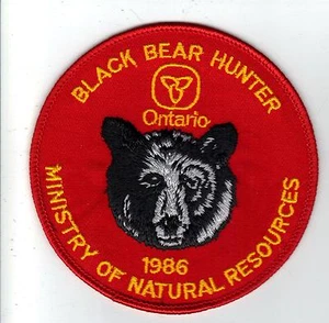 1986 PARCHE DE CAZADOR DE OSOS MNR ONTARIO-MICHIGAN DNR CIERVO-ALCE-CRESTA-INSIGNIA-PEZ - Imagen 1 de 1