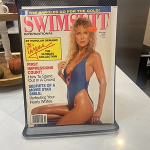 Oct '90 Swimsuit International - Picture 1 of 14