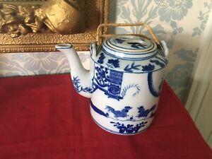 ORIENTAL BLUE AND WHITE TEA POT WITH WICKER HANDLES