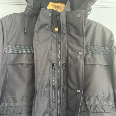Parka aislante pesado Caterpillar CAT para hombre talla mediana M negra reflectante con capucha Foto 1 de 4