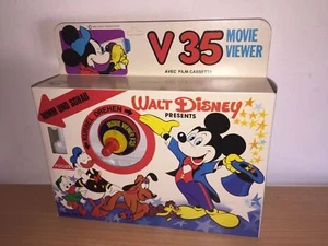 Mupi WALT DISNEY VISORE a Manovella + Cassetta PETER PAN MIB, 1980 - Foto 1 di 3