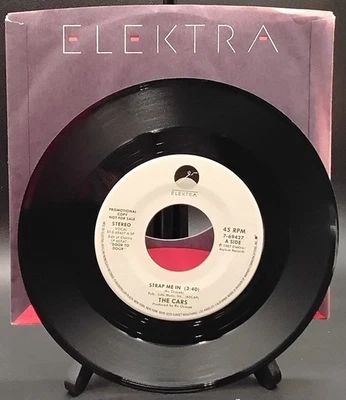 45 RPM -The Cars – Strap Me In - Elektra – 7-69427 PROMO WHITE LABEL 1987 - Image 1 of 2