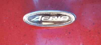 Suzuki Aerio 2002-2007 lado derecho pasajero guardabarros emblema logotipo insignia OEM Foto 1 de 3