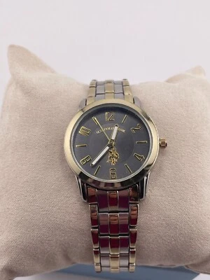 Reloj Hombre Asociación Polo de Estados Unidos Nuevo sin Etiquetas Banda Plateada y Dorada con Cara Negra Foto 1 de 3
