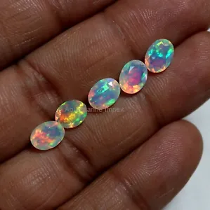 6x8 MM Oval Cut Natural AAAA Red Green Blue Flashy Fire Ethiopian Opal Wholesale - Picture 1 of 13