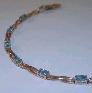 10 Karat Damen Armband massiv Gelbgold mit ovalen Aquamarin/Topas blauen Edelsteinen - Bild 1 von 5