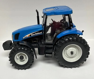 New Holland TS125 A 1/16 Die-Cast Tractor ERTL w/ Openable Hood & Engine Detail - Image 1 of 4