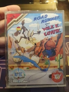 ROAD RUNNER & WILE E. COYOTE COMMODORE 64 GIOCO ORIGINALE CASSETTA C64 GAME - Afbeelding 1 van 6
