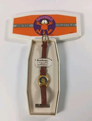Reloj analógico de cuarzo pequeño de cuero marrón con estuche Armitron Garfield de colección para mujer Foto 1 de 4