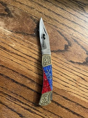 Navaja de bolsillo vintage con mango de cuerno con bloqueo roja y azul Foto 1 de 2