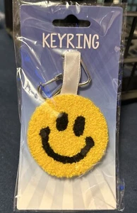 Neu mit Etikett Kalan gelb schmelzendes Smiley Gesicht Schlüsselanhänger Schlüsselanhänger - Bild 1 von 3