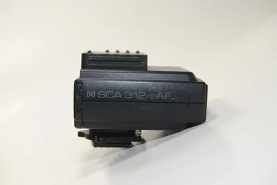 Adaptador de zapata Metz Sca 312/2 AF M para Canon EOS 620/650 - sin probar Foto 1 de 4