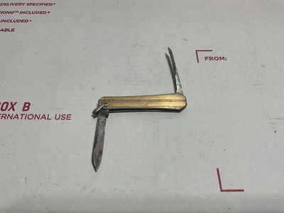 Navaja de bolsillo plegable vintage dorada con limpiador de tuberías Foto 1 de 4