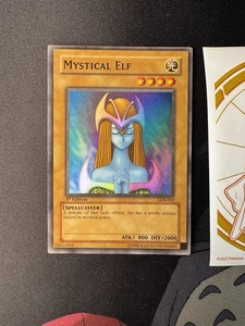 2002 YUGIOH 1ST Edition LOB-062 MYSTICAL ELF SUPER RARE Glossy NA 066💎NM +💎 - Picture 1 of 14