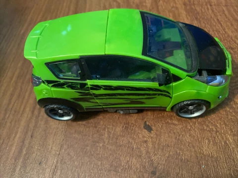 Transformers Revenge Of The Fallen Autobot Skids Green Chevy Spark ROTF 2008 Cover