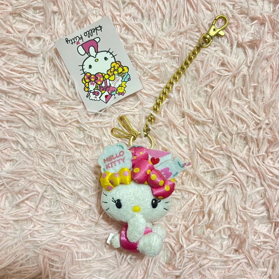 Porte-clés Hello Kitty ruban coloré breloque rare vintage avec usure - Photo 1/4