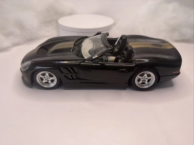 BURAGO 1999 SHELBY SERIE ESCALA 1 1/18 FUNDIDO A PRESIÓN NEGRO y dorado Light Danage Foto 1 de 4