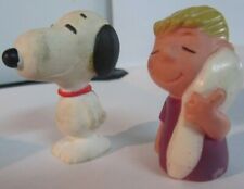 Two Peanuts 2" Rubber Figures: a 1986 Snoopy and 1952 Linus w/blanket