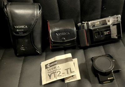 Cámara fotográfica compacta KYOCERA TD Carl Zeiss Tessar 35 mm F3,5 con papeles - sin probar Foto 1 de 4