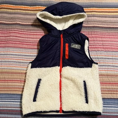 Chaleco acolchado forrado de lana Eddie Bauer para niños azul marino naranja talla 5 con capucha Foto 1 de 4