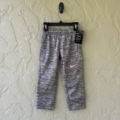 Pantalones deportivos Nike Dri Fit para niños talla 4/XS gris polar térmico NUEVO Foto 1 de 4