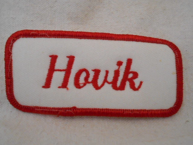 HOVIK USED EMBROIDERED  SEW ON NAME PATCH TAG RED ON WHITE - Image 1 of 1