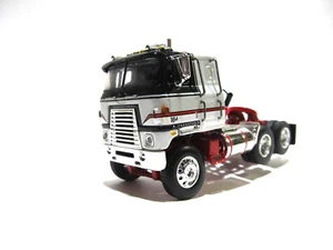 DCP FIRST GEAR ESCALA 1/64 INTERNACIONAL TRANSTAR CABOVER GRIS NEGRO Y BLANCO - Imagen 1 de 6