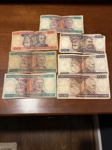 Lotto di 7 banconote Cruzeiros 1981-86 Brasile 100, 200, 500 e 5000, UNC - Foto 1 di 2