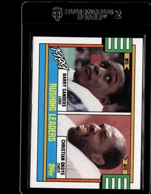 1990 Topps #28 1989 Rushing Leaders Barry Sanders / Christian Okoye - Image 1 of 2