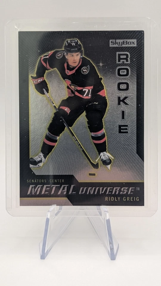 2023-24 Metal Universe RIDLY GREIG Rookie RC R-34 – Ottawa Senators – Skybox - Image 1 of 2