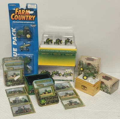 John Deere Lot Ertl 2× Model A 50th Anniv 2× Dubuque Sets 2× Card Tins Blue Pack - Image 1 of 4