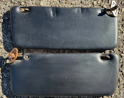 1986-1994 Nissan Hardbody D21 Pickup Black/Tan Driver & Passenger Sun Visors - Image 1 of 2