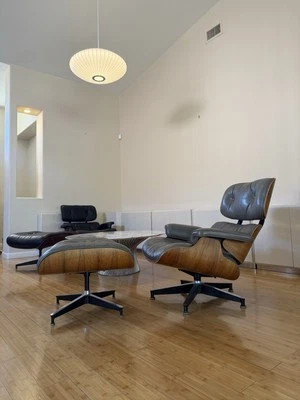 Sillón Eames de palisandro y otomana de cuero gris Herman Miller 1985 Foto 1 de 4