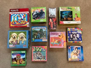 11 Jigsaw Puzzles 100 Pieces Each - Fun for Boys - Dino, Snoopy, Space, Dog, Cat - Picture 1 of 4