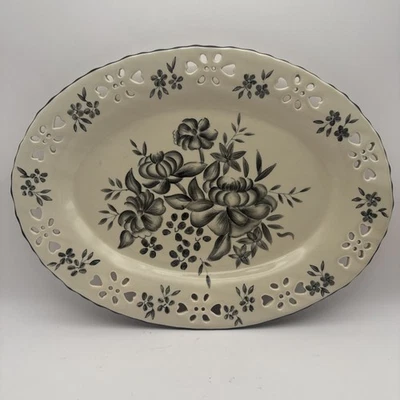 Placa ovalada de cerámica para interiores del hogar flores blancas y negras artículos de transferencia Foto 1 de 4