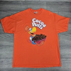 T-shirt arancione Cocoa Puffs cereali taglia XL con grafica gonfia / lettere - Foto 1 di 8