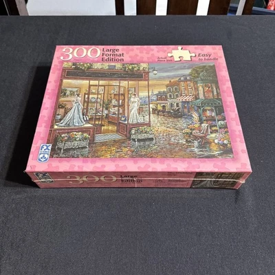 FX Schmid 300 Piece Large Format Jigsaw Puzzle The Wedding Shop Complete 18x24" - Image 1 of 4