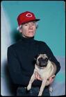 Photo:Andy Warhol [[with Cincinnati reds hat and pug. Artist]] 2