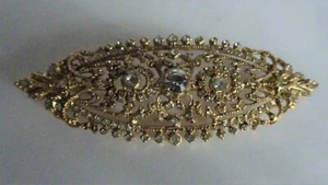 BROCHE OVALADO DORADO CON PEDRERIA - Imagen 1 de 2