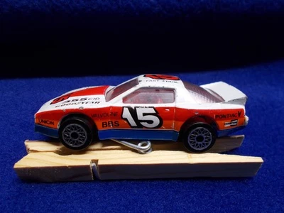 Matchbox MB60 Firebird Racer White w/ Red, Orange & Blue Lower, #15 "Fast Eddie" - Image 1 of 3
