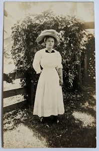 RPPC Lovely Lady HUGE Hat Photo c.1930's Long Dress Fence Trumpet Vine Postcard - Picture 1 of 3