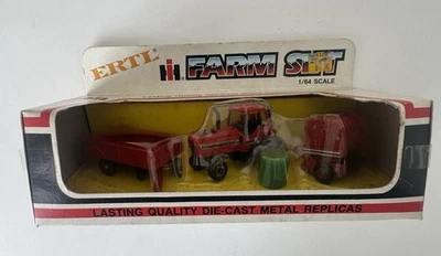 ERTL Farm Set IH Tractor, Round Baler, W/ Bale Of Hay, And Wagon #1860 metal  ￼ - Image 1 of 4