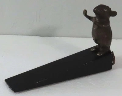 Tapón de tope de puerta de latón vintage con base de cuña de madera negra Foto 1 de 4