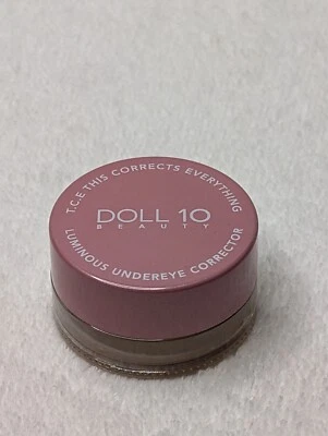 Doll 10 T.C.E Luminous Undereye Corrector Amber 0.12 Oz. Under Eye New  - Image 1 of 2