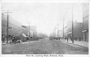 Postal J60/Midland Michigan c1910 tiendas de la calle principal miran al oeste 60 - Imagen 1 de 4