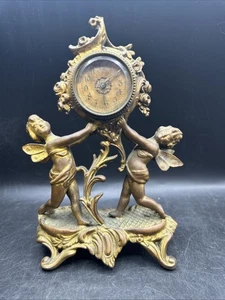 Orologio cherubino vintage in metallo pesante - Foto 1 di 13