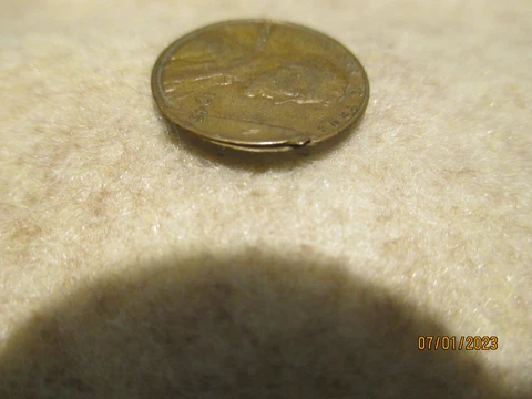 Error Coin:1945-P Lincoln Cent With Partially Detached Obverse Lamination Cover