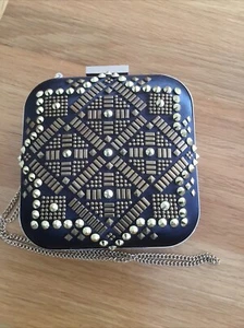 Olga Berg black satin clutch with gold trim and studs and detachable gold chain. - Picture 1 of 5