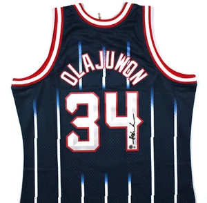 Camiseta deportiva firmada por Hakeem Olajuwon de los Rockets Mitchell & Ness - Beckett con holograma *negra - Imagen 1 de 3