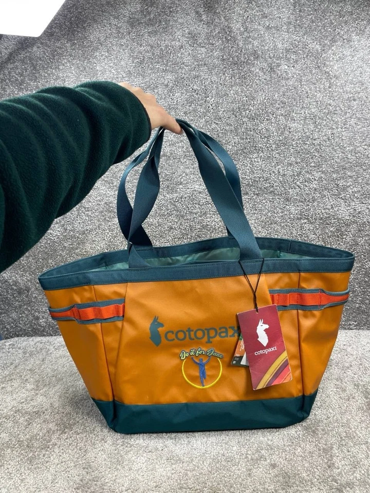 Bolso de Mano Cotopaxi Bags Allpa 30L Gear Hauler Tamarindo Abyss Doble Mango Correa Foto 1 de 4